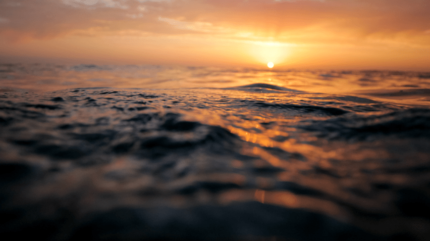 A sun rising, or is it setting, over the wide open ocean
