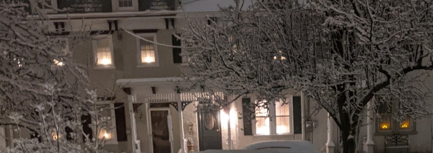 a neighborhood covered in snow
